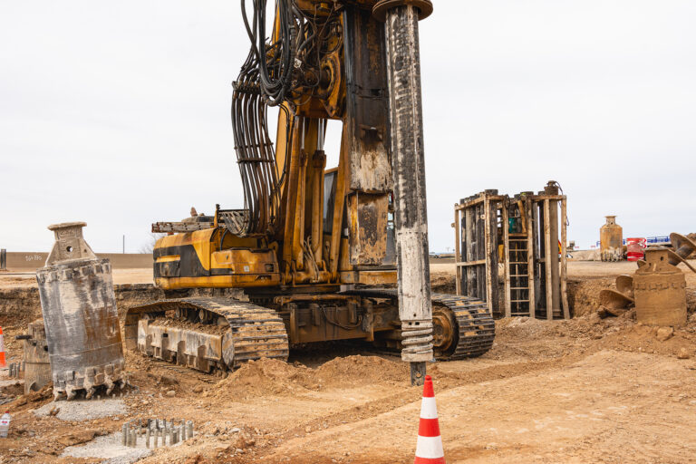 Construction site with machinery and supplies for ongoing construction